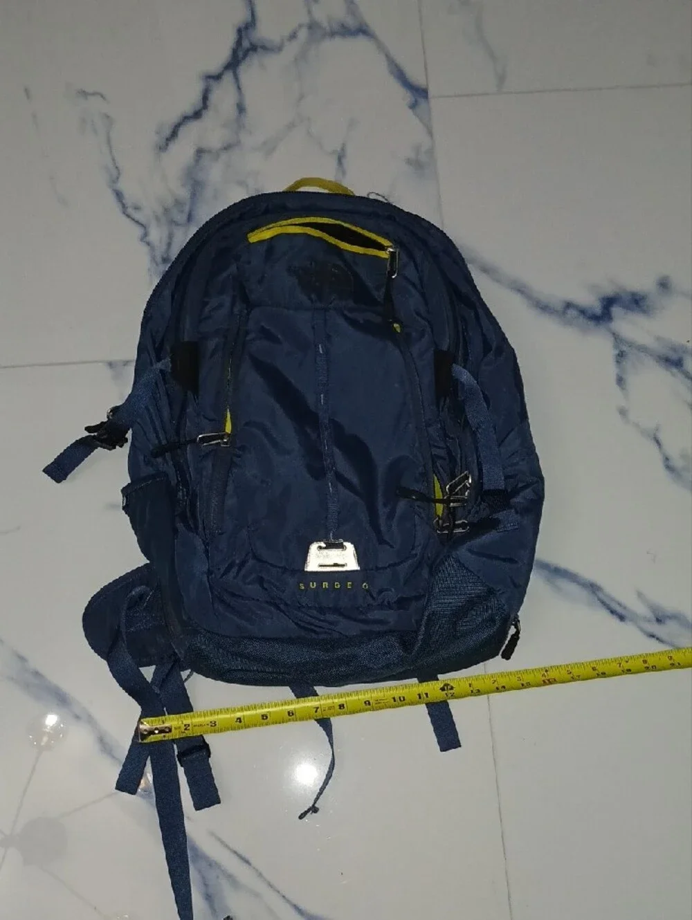 The North Face Navy Blue Backpack with Yellow Accents